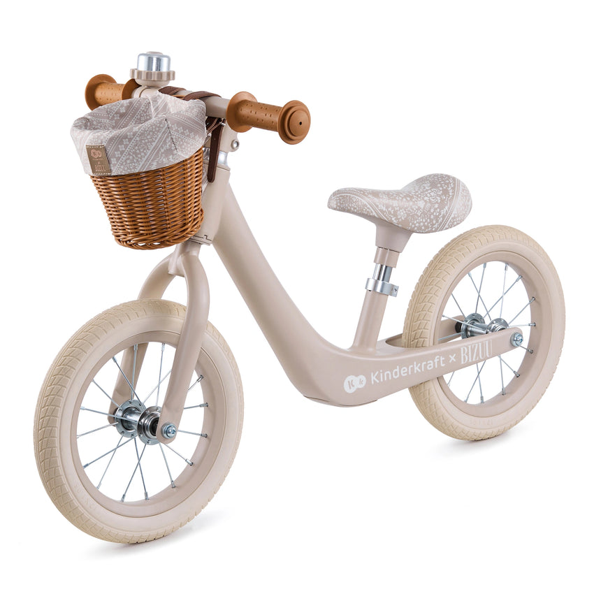 Kinder Kraft Rapid 2 lightweight magnesium balance bike in Whisper Dune with wicker basket, side view