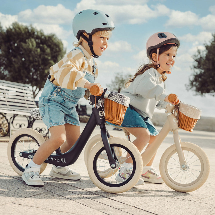 Kinder Kraft Rapid 2 Whisper Dune balance bike at the park, first bike for ages 2+