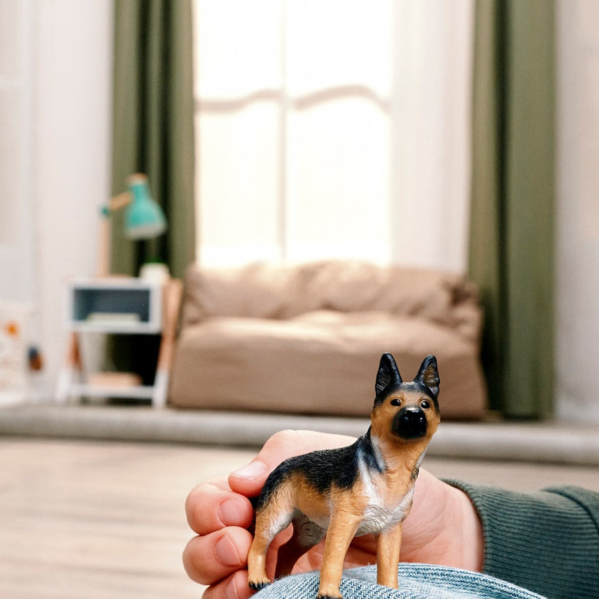 Schleich German Shepherd Female toy figure held during play