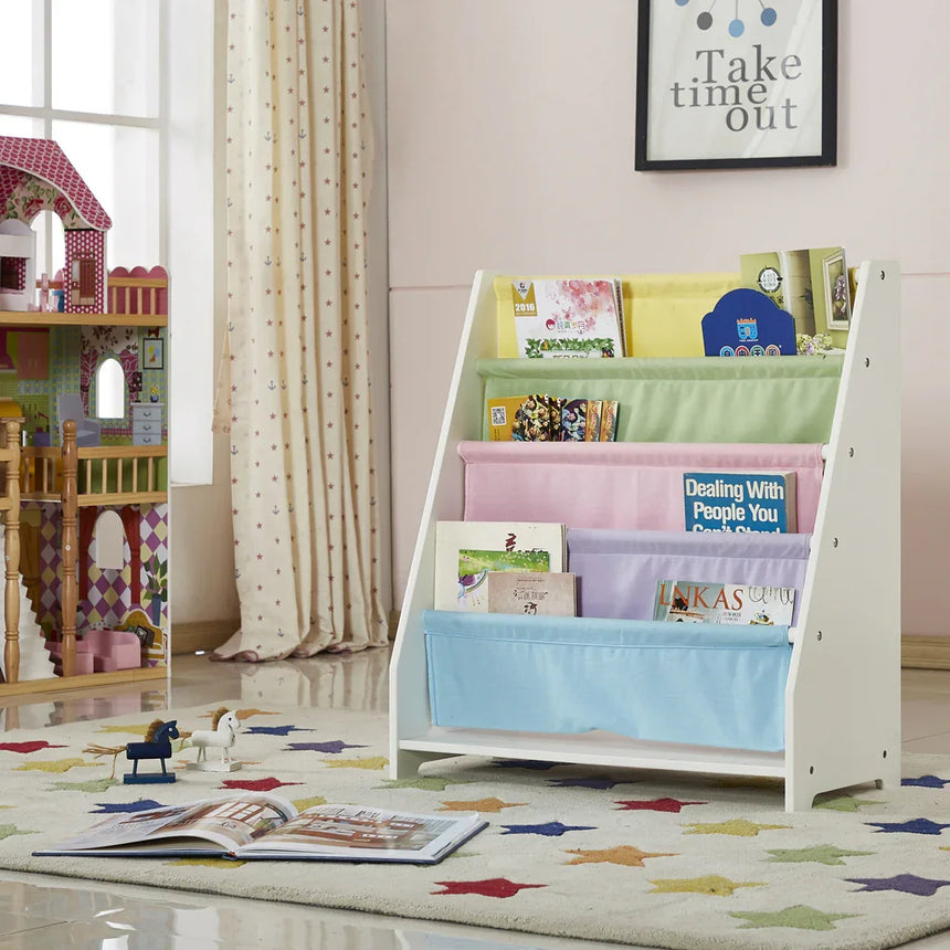 Charlie White kids canvas sling bookcase with pastel fabric pockets displaying books in a child's room