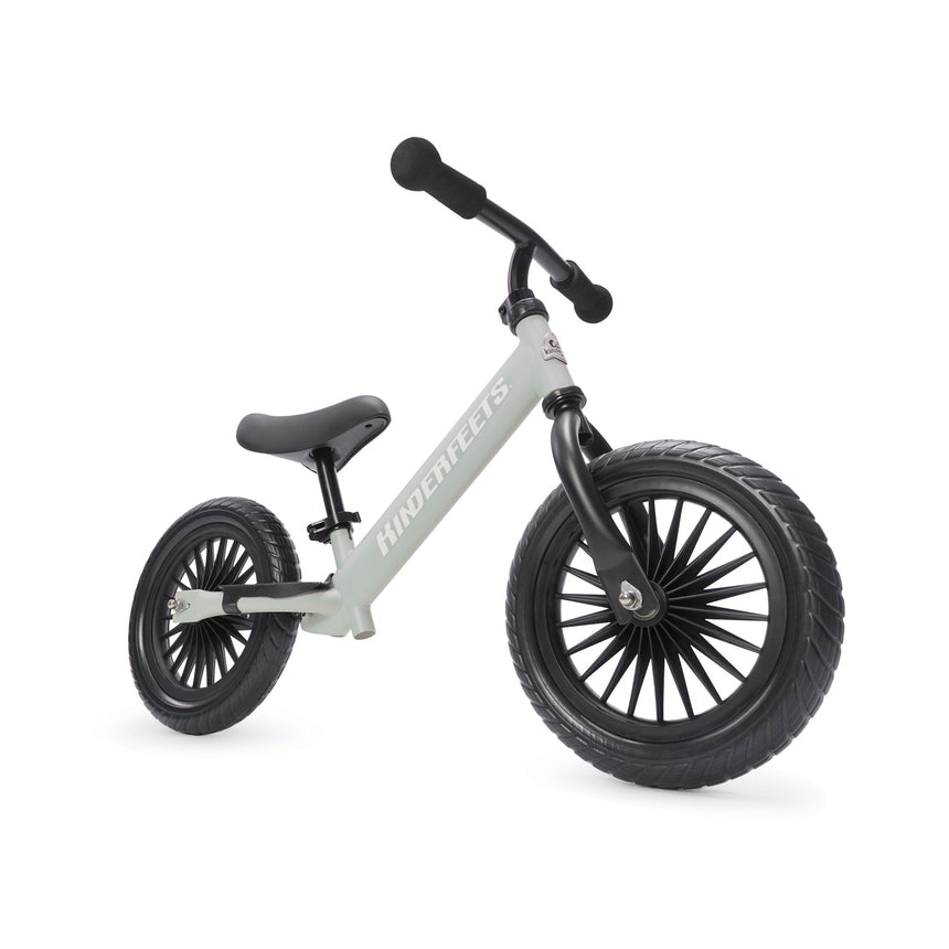 Kinderfeets Trail Bike in Silver Sage – matte pale green metal balance bike with puncture-proof tyres
