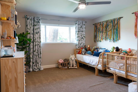 A modern kids bedroom with two low-profile single beds side by side