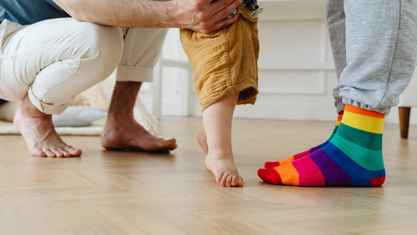 Toddler learning to walk and build leg strength through active play