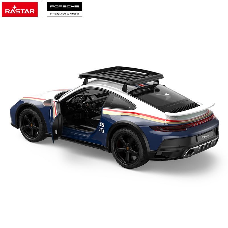Rastar 1:14 Porsche 911 Dakar Performance RC car shot from a directly overhead angle with both doors open, displaying the navy blue and white #953 Roughroads Dakar race livery, the roof rack, and the detailed interior cabin.