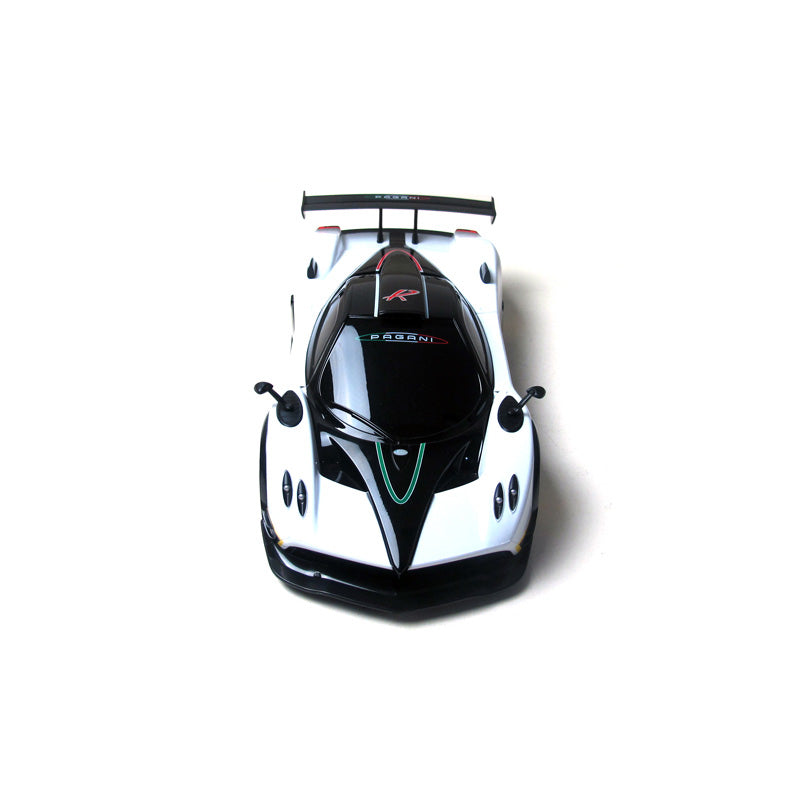 Rastar 1:14 Pagani Zonda R RC car photographed from a directly overhead angle, revealing the full white and black body with the black roof/canopy, Italian tricolour centre stripe, large multi-element rear wing, and twin exhaust stacks.