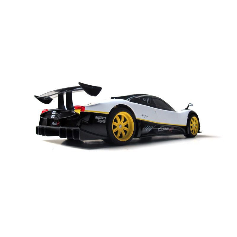 Rastar 1:14 Pagani Zonda R RC car in white and black livery with yellow wheels, photographed from a rear three-quarter angle showing the multi-element rear wing, round tail lights, "Zonda R" and "Pirelli BSPO" rear badging, and the distinctive quad-exhaust pipe cluster.