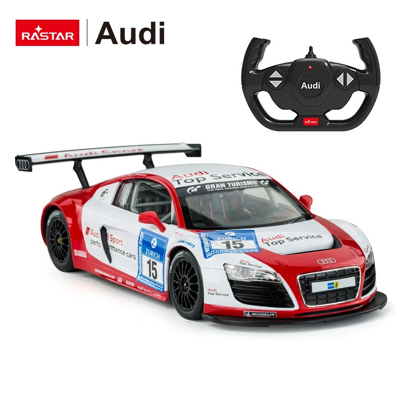 Rastar 1:14 Audi R8 LMS Performance RC car in red and white #15 "Audi Sport Top Service" Nurburgring race livery, shown from a front three-quarter angle alongside the Audi-branded steering-wheel remote controller displayed above; Gran Turismo, Zurich, Michelin, Bilstein, and Audi quattro GmbH sponsor logos are visible.