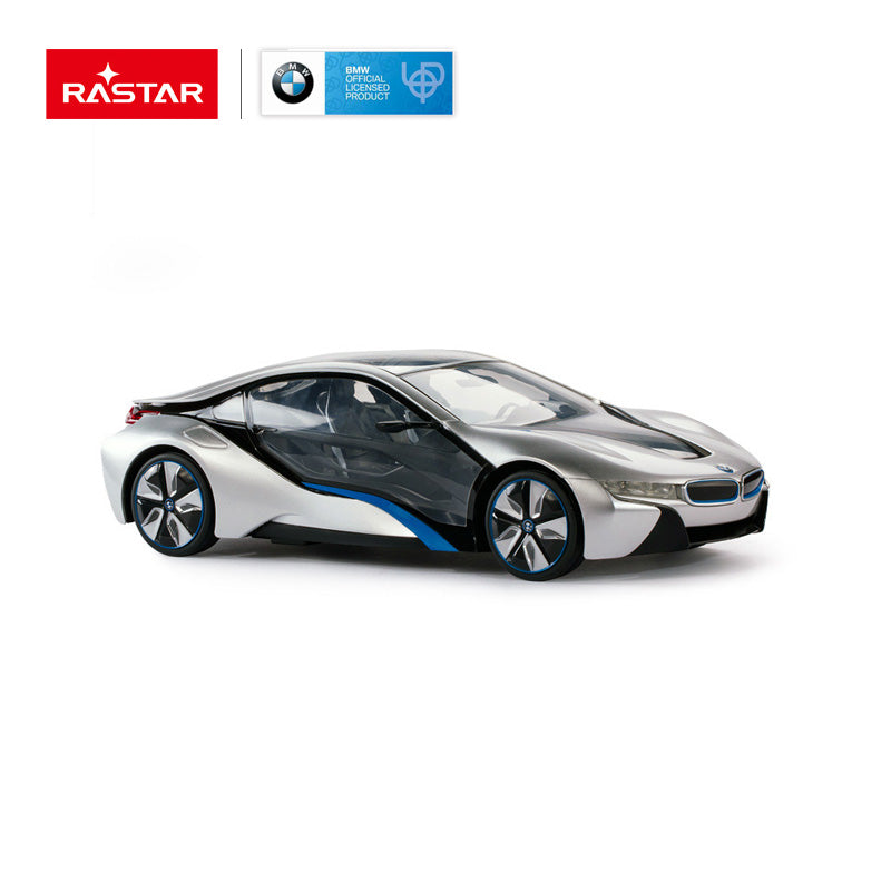 Rastar 1:14 BMW i8 RC car in silver and black with blue accents photographed in rear 3/4 view, showing the sleek fastback roofline, large panoramic canopy, and distinctive blue-trimmed wheels; BMW Official Licensed Product badge shown.