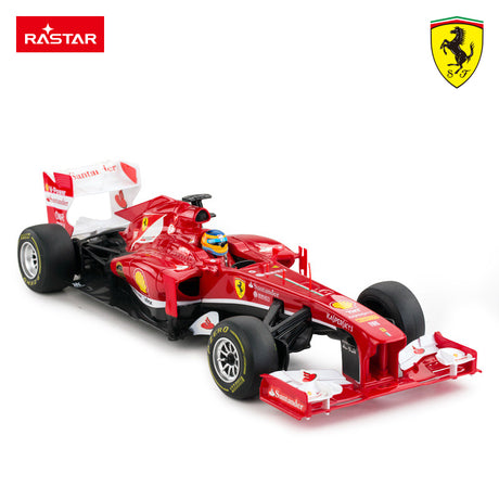 Red Ferrari F1 toy race car with driver helmet, Santander & Shell logos, Rastar brand