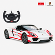 Rastar 1:14 Porsche 918 Spyder Performance RC car in white with red number 3 racing livery, shown in front 3/4 view alongside the Porsche-branded steering wheel remote controller, with Rastar and Porsche logos in the top-right corner.