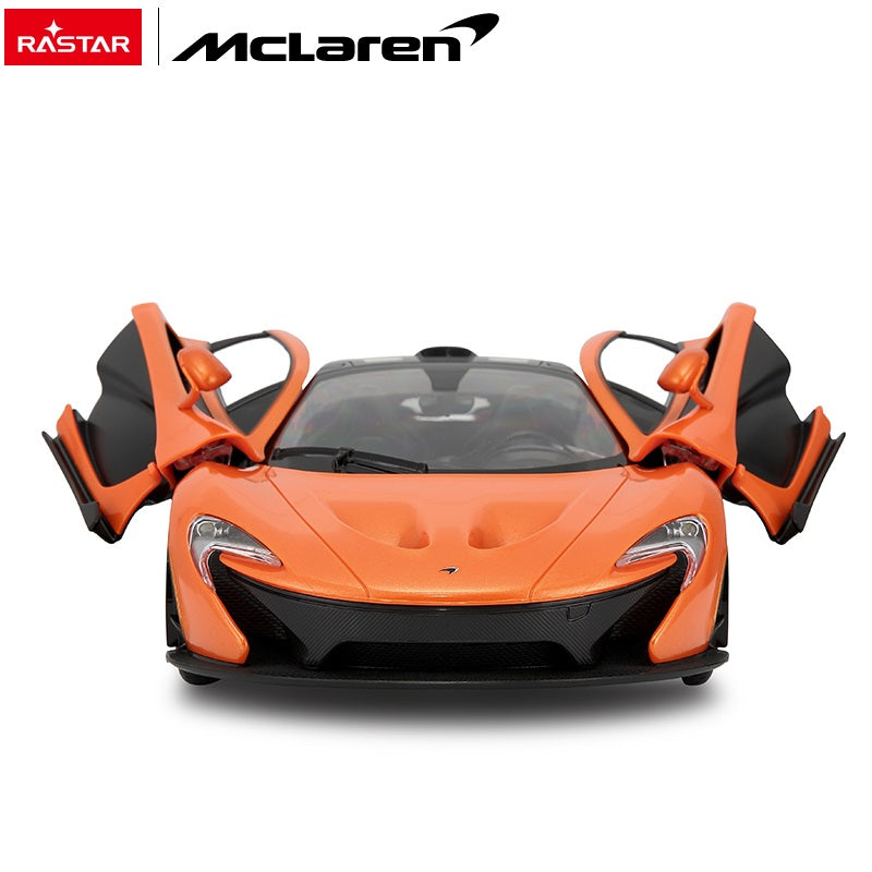 Front-on view of the Rastar 1:14 McLaren P1 RC car in orange with both dihedral doors open, showcasing the distinctive narrow front splitter, LED headlights, and carbon-effect lower bodywork.