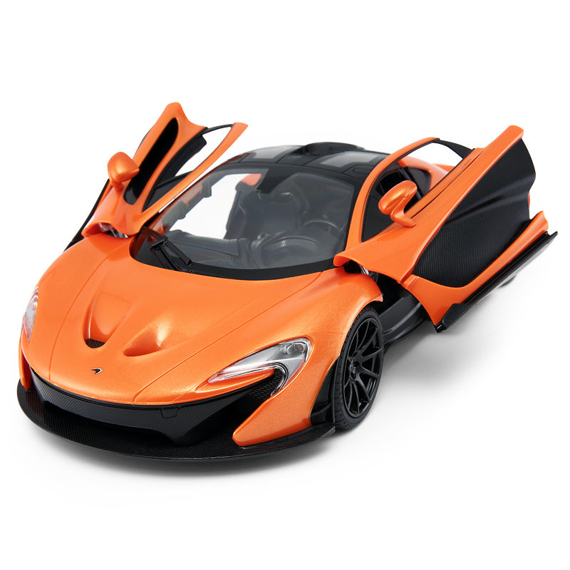 Close-up elevated front 3/4 view of the Rastar 1:14 McLaren P1 RC car in orange with dihedral doors open, revealing the detailed interior cabin with racing seats and the sculpted bonnet with intake vents.