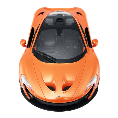 Overhead front view of the Rastar 1:14 McLaren P1 RC car in orange, showing the sculpted bonnet with intake vents, transparent roof panel revealing the interior, and the windscreen wiper detail.