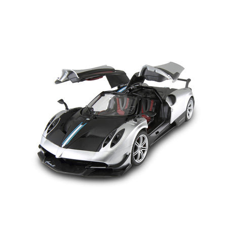 Rastar 1:14 Pagani Huayra BC RC car in silver and carbon fibre two-tone finish, elevated front 3/4 view with both gull-wing doors open revealing the red interior cabin.