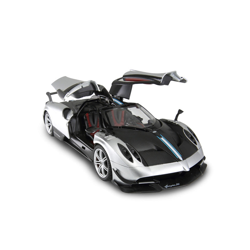 Rastar 1:14 Pagani Huayra BC RC car in silver and carbon fibre finish, elevated front 3/4 view with both gull-wing doors open, showing the Huayra BC script on the sill and red interior visible through the open cabin.