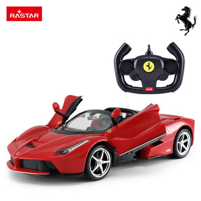 Rastar 1:14 Ferrari LaFerrari Aperta RC car in Ferrari red, front 3/4 view with both butterfly doors open, shown alongside the Ferrari-branded Rastar steering wheel controller; open-top roadster body and Ferrari prancing horse logo are clearly visible.