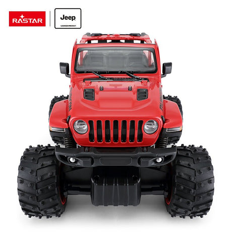 Rastar 1:14 Jeep Wrangler Rubicon Big Foot RC car in red viewed directly front-on, showing the full-width seven-slot grille, round headlights, fog lights on the front bumper, and the imposing wide stance of the oversized bigfoot tyres.