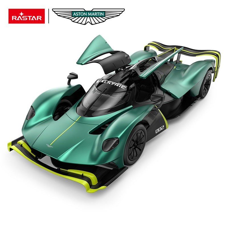Rastar 1:14 Aston Martin Valkyrie AMR Pro RC car in racing green with neon yellow highlights and number 002 from a front overhead 3/4 angle with butterfly door open, revealing the full canopy cockpit interior, dramatic rear wing, and the car's extreme aerodynamic contours.