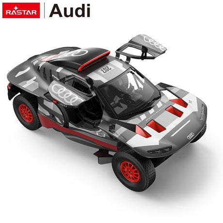 Rastar 1:14 Audi RS Q e-tron E2 RC car in grey, white and red rally livery seen from a high front 3/4 angle, with gull-wing doors open revealing the detailed interior and large off-road tyres with red alloy wheels.
