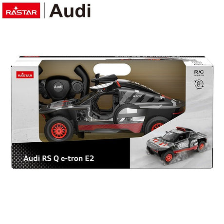 Rastar 1:14 Audi RS Q e-tron E2 RC car in grey and red Dakar livery shown inside its retail packaging box, with the car visible through the window box and a smaller action image printed on the side panel.
