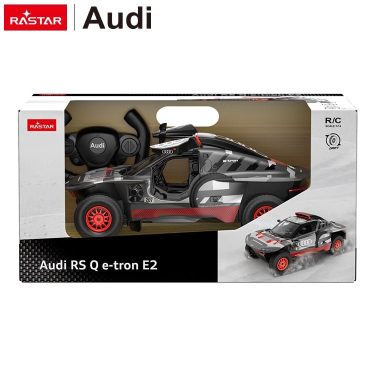 Rastar 1:14 Audi RS Q e-tron E2 RC car in grey and red Dakar livery shown inside its retail packaging box, with the car visible through the window box and a smaller action image printed on the side panel.