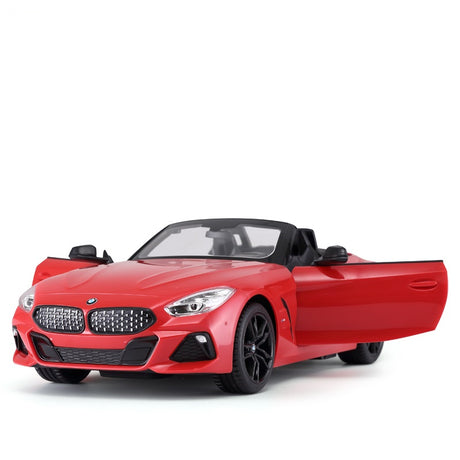 Rastar 1:14 BMW Z4 Roadster RC car in red shown from a front 3/4 angle with the driver's door open, highlighting the open convertible roof, BMW grille detail, LED headlights, and black alloy wheels.