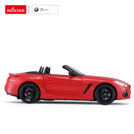 Rastar 1:14 BMW Z4 Roadster RC car in red shown in a clean right side profile view, highlighting the sleek low convertible silhouette, M40i badge, open roofline, and black alloy wheels.