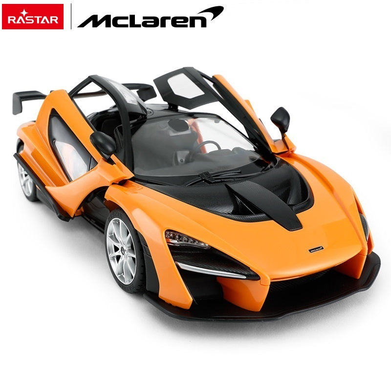 Rastar 1:14 McLaren Senna RC car in orange, overhead front view with both scissor doors open revealing the detailed interior cabin and carbon-effect body panels.