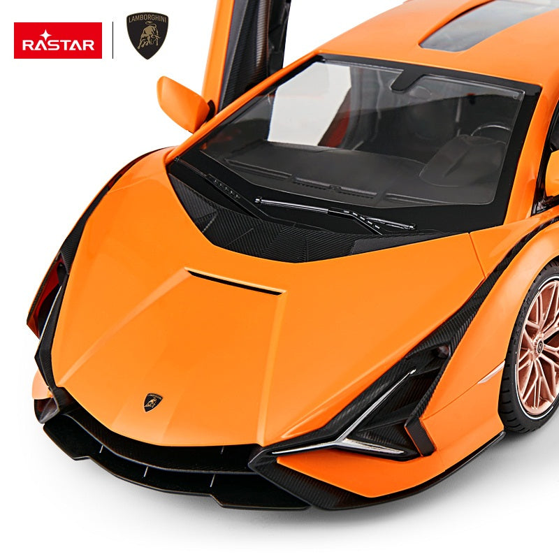 Rastar 1:14 Lamborghini Sian FKP 37 RC car in orange, detail closeup from the front three-quarter angle with scissor doors open, highlighting the carbon-effect bonnet, Lamborghini badge, sharp LED headlight design, and carbon front splitter.