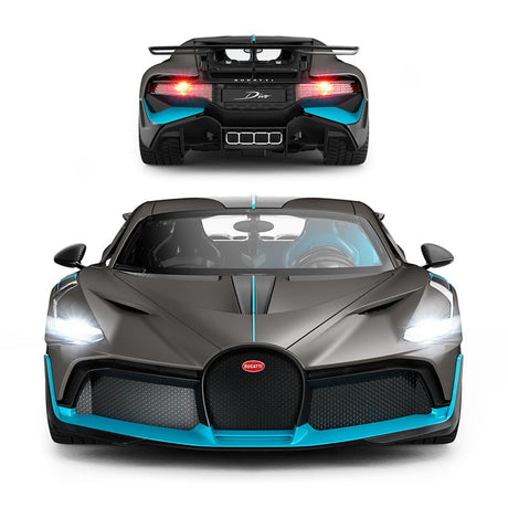 Rastar 1:14 Bugatti Divo RC car in matte grey with teal/blue accents, detailed rear 3/4 closeup from above with door open, showing the carbon-look louvred engine deck, large rear wing, and "BUGATTI" lettering on the diffuser. Rastar and Bugatti branding logos appear in the corner.