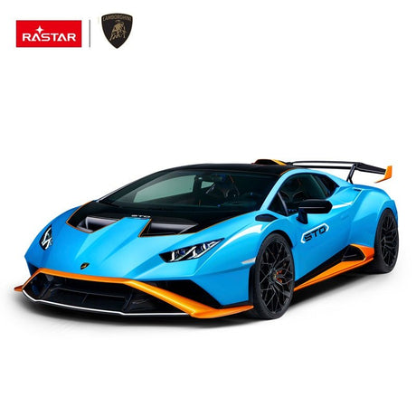 Rastar 1:14 Lamborghini Huracan STO RC car in sky blue with orange accents shown in front 3/4 profile without doors open. The shark-nose front splitter, angular headlights, STO hood scoop, wide wheel arches, and large rear wing are highlighted on a white background.
