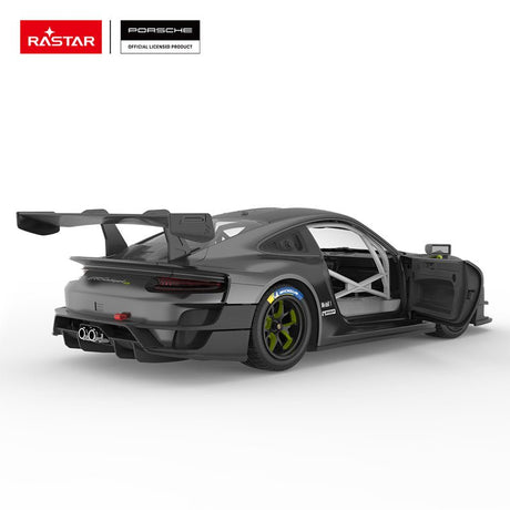 Rastar 1:14 Porsche 911 GT2 RS Clubsport 25 RC car in matte dark grey with neon green accents shown from rear 3/4 angle with door open, revealing the roll cage interior. The Michelin-branded tyre, green-spoke wheel, Manthey livery, large carbon rear wing, and open door with race-spec interior are all prominent.