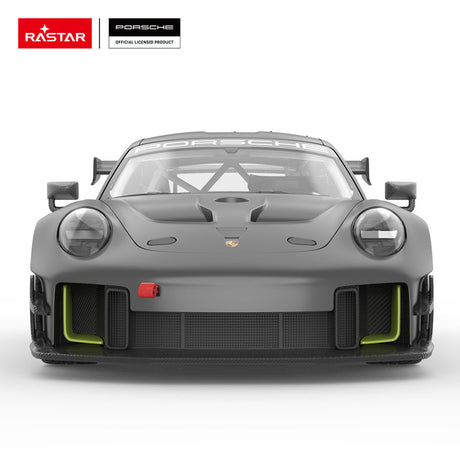 Rastar 1:14 Porsche 911 GT2 RS Clubsport 25 RC car in matte dark grey with neon green accents shown front-on. The front view highlights the wide flat nose, Porsche crest, twin round headlight housings, neon green lower bumper accents, and large front splitter air intakes.