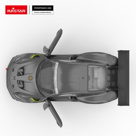 Rastar 1:14 Porsche 911 GT2 RS Clubsport 25 RC car in matte dark grey with neon green accents viewed from directly above with door open. The overhead view shows the "PORSCHE" windscreen banner, full roof panel, roll cage visible through the windows, neon green body accents, and the massive carbon rear wing extending beyond the body.