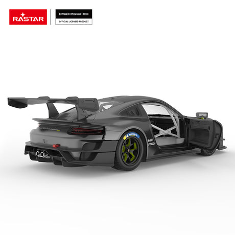 Rastar 1:14 Porsche 911 GT2 RS Clubsport 25 RC car in matte dark grey with neon green accents shown from rear 3/4 angle with door open, revealing the roll cage interior. The Michelin-branded tyre, green-spoke wheel, Manthey livery, large carbon rear wing, and open door with race-spec interior are all prominent.