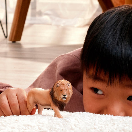 Schleich Lion toy figure in play scene