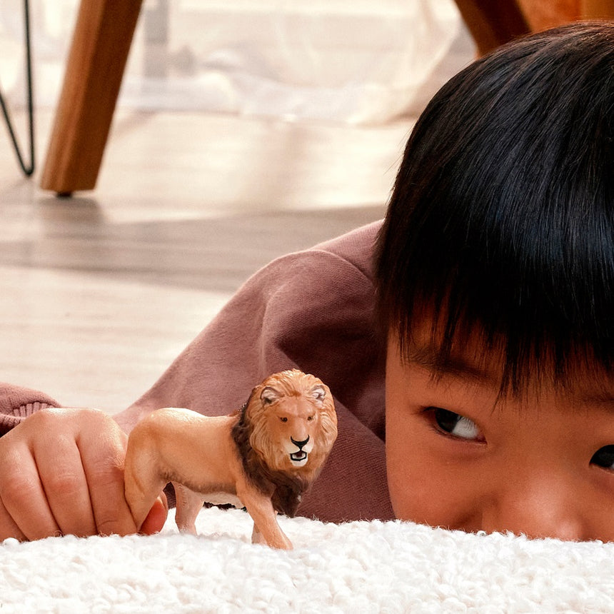 Schleich Lion toy figure in play scene