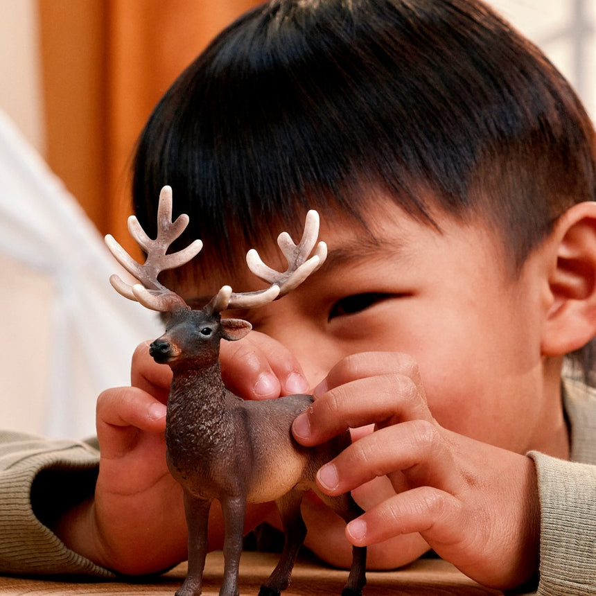 Schleich Elk toy figure held during play