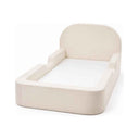 Beige Cloudnest foam toddler bed, angled view with rounded headboard and side rails
