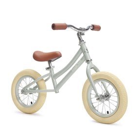 Kinderfeets City Bike in Silver Sage – pale green retro metal balance bike with cream air tyres and brown seat