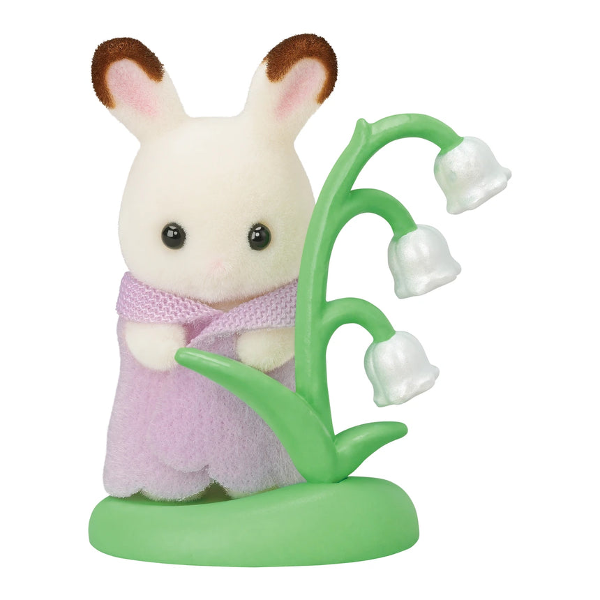 Close up of Sylvanian Families Baby Forest Costume Series chocolate rabbit baby with lily of the valley accessory