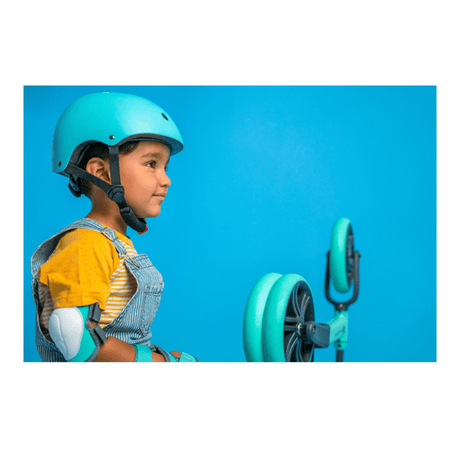 Green Yvolution kids wrist guards with adjustable velcro straps