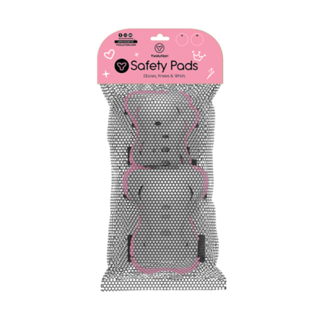 Child wearing pink Yvolution safety pads while riding a scooter