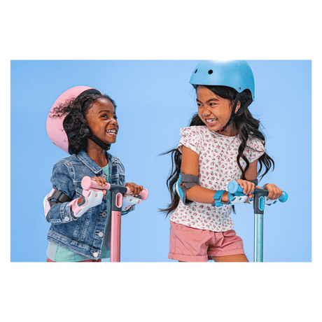 Pink Yvolution kids wrist guards with adjustable velcro straps